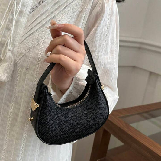 Black oval leather bag